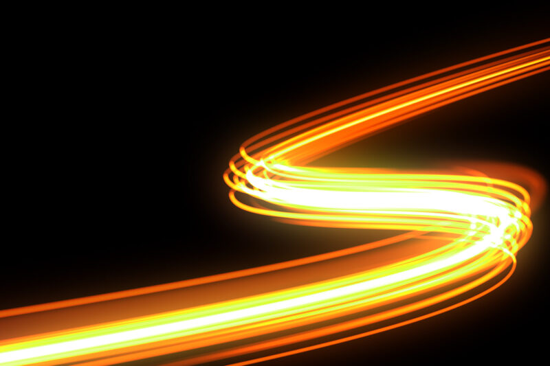 Bright light trail, orange neon glowing wave trace, energy flash and fire effect. Magic glow swirl trace path, optical fiber technology and light in speed motion on black background