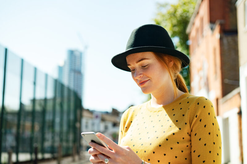 Young woman using smart phone