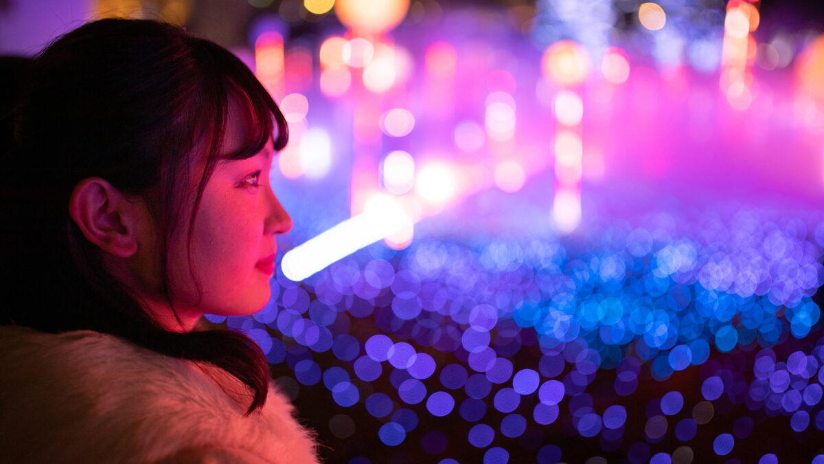 Young woman watching Christmas illumination